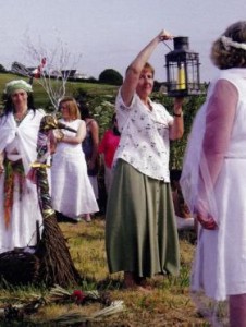 Sister Mary Minehan, a Brigidine nun, holds the perpetual flame brought from their house at Kildare in Ireland to Bride’s Mound, Beckery, where a special garden was built to honour the goddess Brigid in 1994.