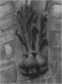 One of the building's many details in the form of fruit or vegetables - in this case a bunch of onions