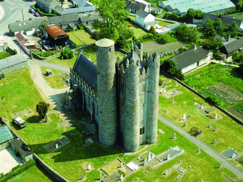 The medieval parish church at Lusk was a twin-aisled building of considerable size. The church's substantial west tower still stands-an imposing edifice with three round turrets incorporated in it to match the ancient round tower that forms the fourth ‘turret'. (Department of the Environment, Heritage and Local Government)