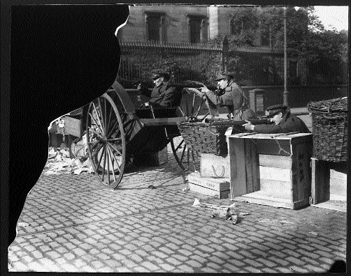 Pro-Treaty National Army troops also take up firing positions behind a barricade in College Street, but in the opposite direction (Trinity College in the background). Neither barricade looks particularly robust and both pictures look suspiciously posed; they may even have been taken in or about the same time, before hostilities commenced.