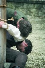 Free Stater Teddy grieves over the body of Damien, his anti-Treaty brother, following his summary execution.(All images Pathé Films)