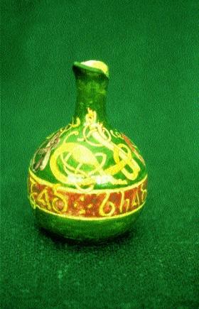 Hand-painted vase with zoomorphic and Celtic spiral decoration, inscribed C. RUSSELL PINXII 6-11-85 and impressed ‘Vodrey Dublin Pottery’. (National Museum of Ireland)