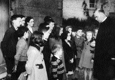 Talking to children in his native Ballymoe, Co. Roscommon, during his 1946 Irish tour. (Hall of History, Boys' Town)