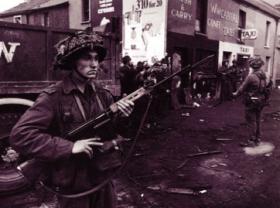 British soldiers (with fixed bayonets) on patrol on the Falls Road in the wake of their deployment on 15 August 1969. (Hulton Getty Picture Collection)