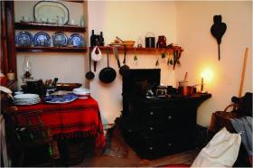 A simple table, two chairs and an old stove take up most of the cramped kitchen. (Keiko Neiwa)