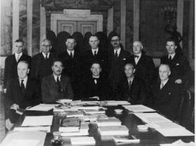 Dev with members of the Irish diplomatic service, including John W. Dulanty (front left), his high commissioner in London, who kept him fully briefed of the developing scandal. (UCD Archives/G. P. Beegan)