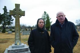 Presenter Brendan Shine with the author of Rising Road, Sharon Davies, at the grave of his grand-uncle, Fr James Coyle , in Birmingham, Alabama. (RTÉ)