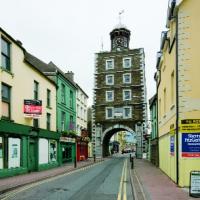 Youghal’s Clock Gate today. In May 1777 an engraver was employed ‘to prepare two marble stones [inset] for the Clock Castle, with the Corporation arms and the magistrates’ names engraved on them’. (NIAH)