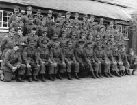 The 33rd Infantry Battalion platoon of Sergeant Hugh ‘Sonny’ Gaynor from Leixlip, Co. Kildare (front row, sixth from right), seated beside Lieutenant Kevin Gleeson (wearing gloves). (Military Archives)