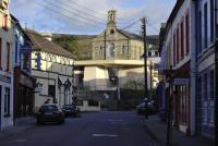 From Bridge Street the library appears to have only one roof, placed like the capping stone on a wedge tomb, held up by two great Egyptian pylons. (NIAH)