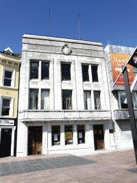 Cork City Library—consciously Hibernian in style—with beautiful Celtic-style carving around the entrance doors and on the balustrade along the first floor. (NIAH)