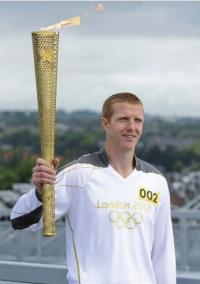 Kilkenny hurler Henry Shefflin carrying the Olympic torch on 6 June 2012—‘Can you imagine what an Olympian Henry Shefflin could have been, in possibly half a dozen sports? Carrying the Olympic torch is only a taster of what many of our sporting talents in Ireland could have achieved were the national games also Olympic ones’. (Brendan Moran/SPORTSFILE)