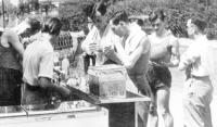 Members of the Irish basketball team enjoy refreshments during the 1948 Olympic Games—Pat Crehan (left) serving Frank O’Connor and Harry Boland, with Paddy Sheriff to the rear (with ball). (Basketball Ireland)