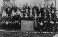 Moy branch of the Gaelic League 1917–18, including IRA officers Séamus Hennessy (inset, posing with a Webley revolver during the Civil War) and Steve Gallagher (front row, third and fourth from the right respectively), who presided over Private Chalmers’s execution and secret burial in June 1921. Tom Tuttle, whose home Private Chalmers had called at shortly before his capture, is in the back row, third from the left. (Colin Hennessy)