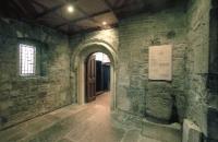 A porch was built on to protect the original Romanesque doorway (centre). Note the ‘lucky stone’ to the right.(All images: Photo Unit, National Monuments Service)