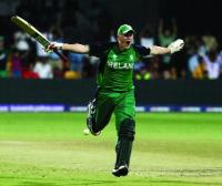 Kevin O’Brien, having just scored the fastest-ever century in World Cup cricket, celebrates Ireland’s stunning three-wicket win over England in Bangalore on 2 March 2011.