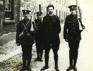 Above: The large photograph at Kilmainham Gaol of de Valera under arrest in 1916, with the caption: ‘Sentenced to die like the other leaders, de Valera would have been the fifteenth man executed at Kilmainham had he not been saved by his American citizenship’. (UCD Archives)