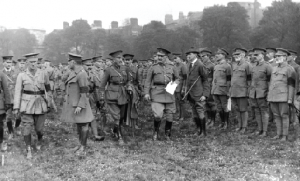 British commander General John Maxwell (holding paper, while reviewing troops in Trinity College, Dublin, 1916) inquired whether de Valera might cause future trouble. ‘I wouldn’t think so, sir, I don’t think he is important enough’, W.E. Wylie, chief prosecuting officer, is quoted as replying. (RTÉ Stills Library) 