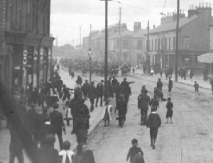 Picketers throw stones at Cameron Highlanders as they advance up the Grosvenor Road, Belfast, August 1907. (Alex R. Hogg)