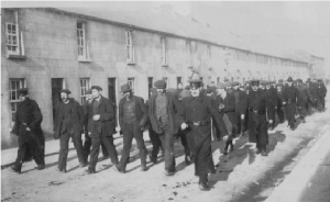 Scab labour being escorted to work in Pierce’s foundry by RIC constables in King Street, Wexford. (Alice White)