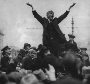 The famous photograph of James Larkin that inspired the monument, taken by Joe Cashman in April 1923. Biographer Emmet O’Connor has observed that the less-than-animated response of the O’Connell Street crowd ‘speaks volumes about the difference between 1913 and 1923, and Larkin’s inability to see this’. (RTÉ Stills Library)