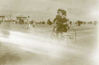 A young female ‘scorcher’ at the seaside. (NLI)