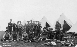 Men of the 2nd Battalion, Royal Munster Fusiliers, take a break while sorting kit at Blandford Camp, England, September 1910. (Imperial War Museum)