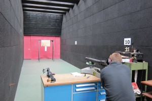 Detective Garda David O’Leary at the Phoenix Park range firing a Lewis machine-gun at a similar piece of fabric. Subsequent photomicrograph comparisons of the sample bullet damage to the holes in the flag revealed multiple similarities. (Rachel Phelan)