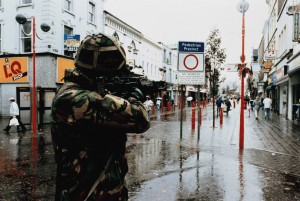 ‘A British soldier checks distant activity . . . during a patrol in the centre of Newry’—official British Army photograph, undated but probably the 1980s. (Imperial War Museum)