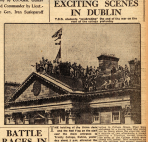 Students hoist the Union Jack—and the Red Flag of the USSR—over the front entrance to Trinity College on VE Day, 8 May 1945. (Irish Independent)