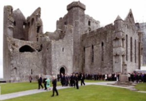 Queen Elizabeth II (related to Edmund MacRichard through her mother) visiting the Rock of Cashel in 2011. As a child, MacRichard was fostered by the archbishop of Cashel, Richard O’Hedian, responsible for various repairs and extensions, including this fortified western end of the cathedral. (Con Brogan/DAHG)