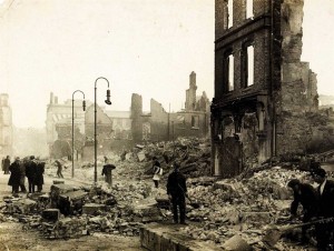 The morning after—Cork citizens pick their way through the rubble.