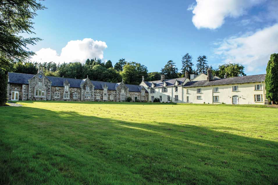 Glendalough House today. Thomas Hugo’s rebuilt 1800 house (the original was burnt down by rebels in 1798) is to the right. Note the high level of the window-sill of the dining room (second window to the left of the door)—allegedly so that the Hugos could dine without fear of a rebel’s bullet. The former stable block is to the left. (NIAH)