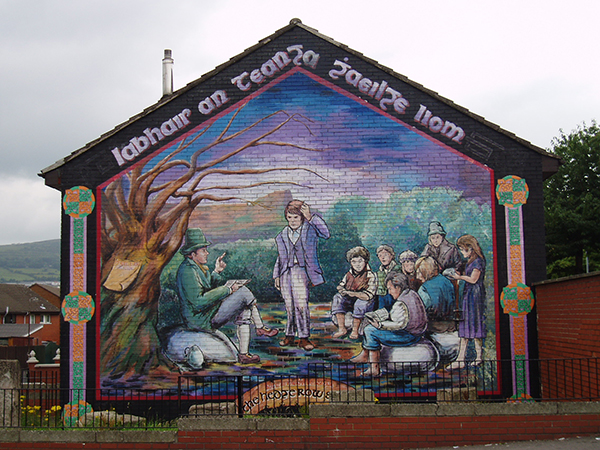 Above: A mural in Belfast depicting a hedge school. (extramuralactivity)